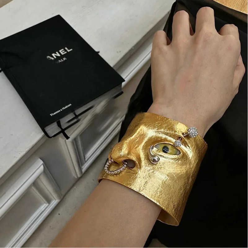 chic Avant-Garde Gold Tone Face Cuff Bracelet with Statement Eye and Crystal Accents Bold Statement Open Cuff bangles