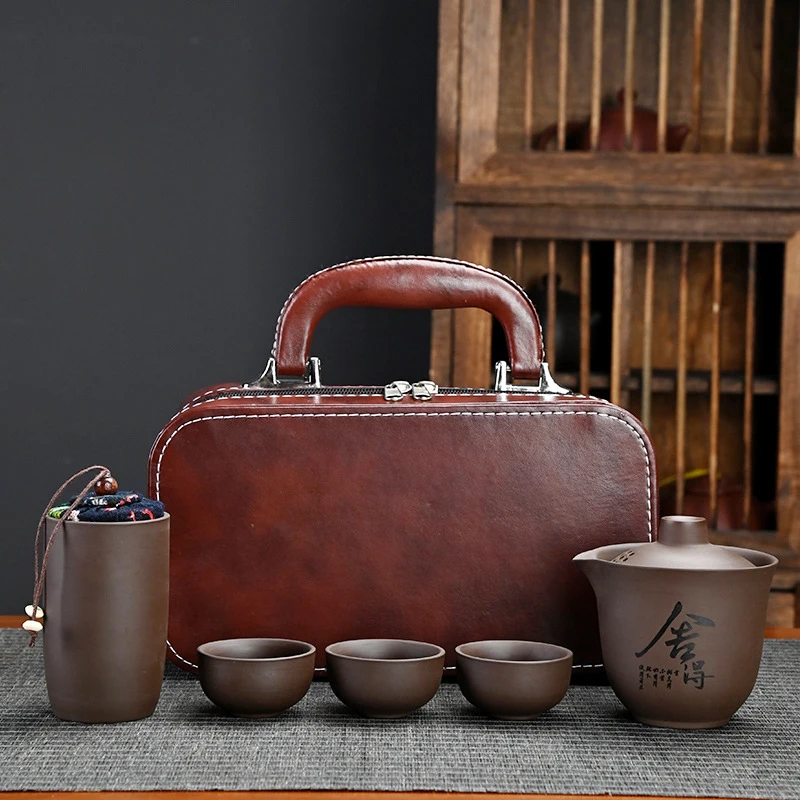 A complete set of travel tea sets wholesale outdoor kung fu tea set quick cup holiday Chinese business gift purple clay
