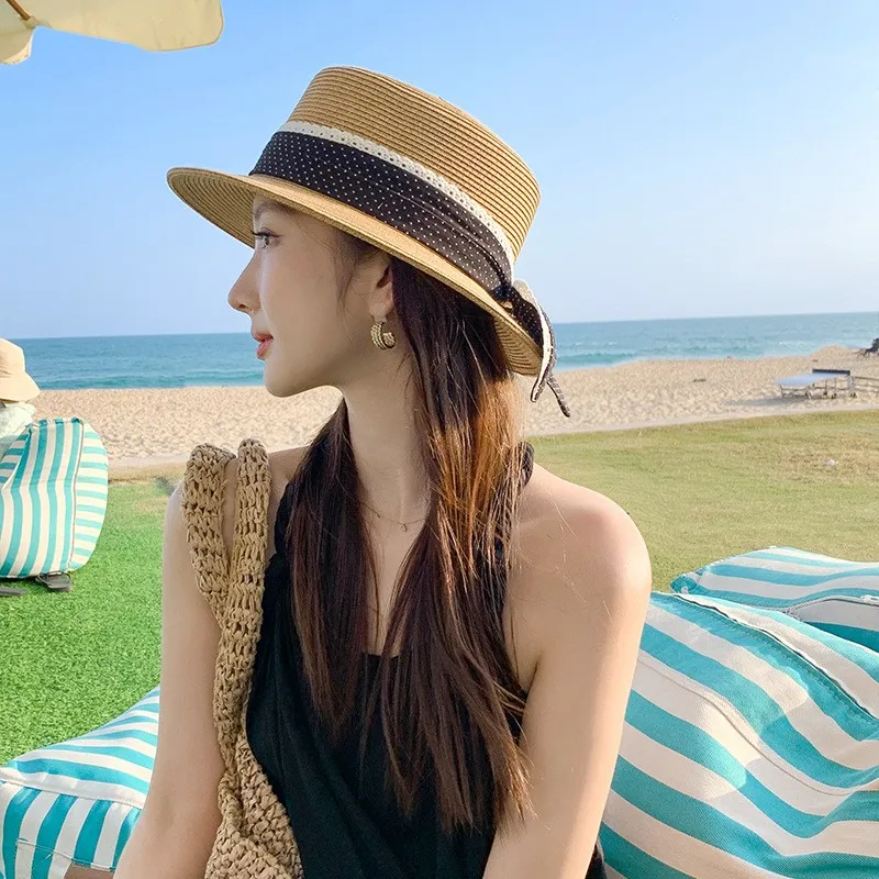 A new style of women's hat with ribbon flat top seaside woven sunshade