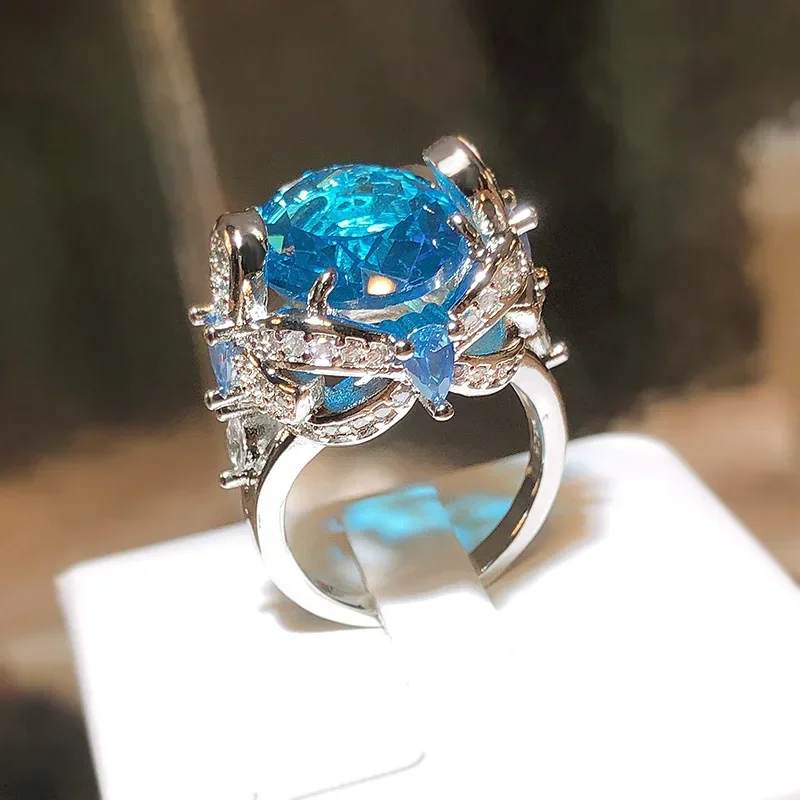 Exquisite weibliche Ringe aus 925er-Sterlingsilber, schillernde hellblaue runde Zirkon-Blumenringe für Frauen, Ehering, Statement-Schmuck