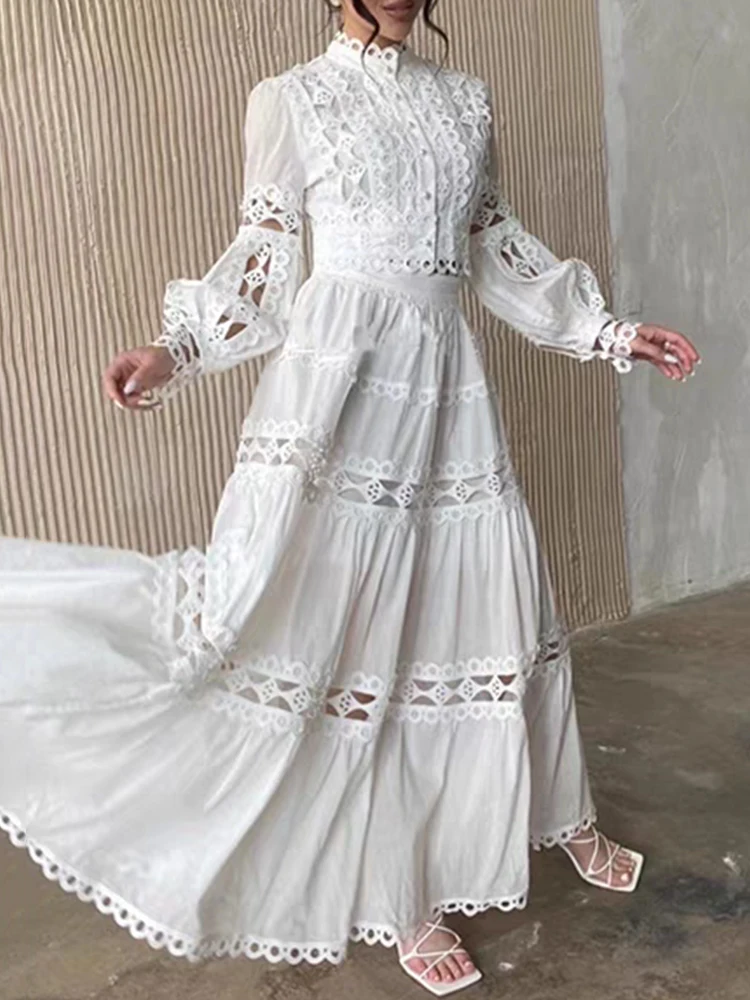 

A two-piece short applied-patterned and hollowed-out shirt set for Spring 2025 women's wear + loose multi-layered skirt set