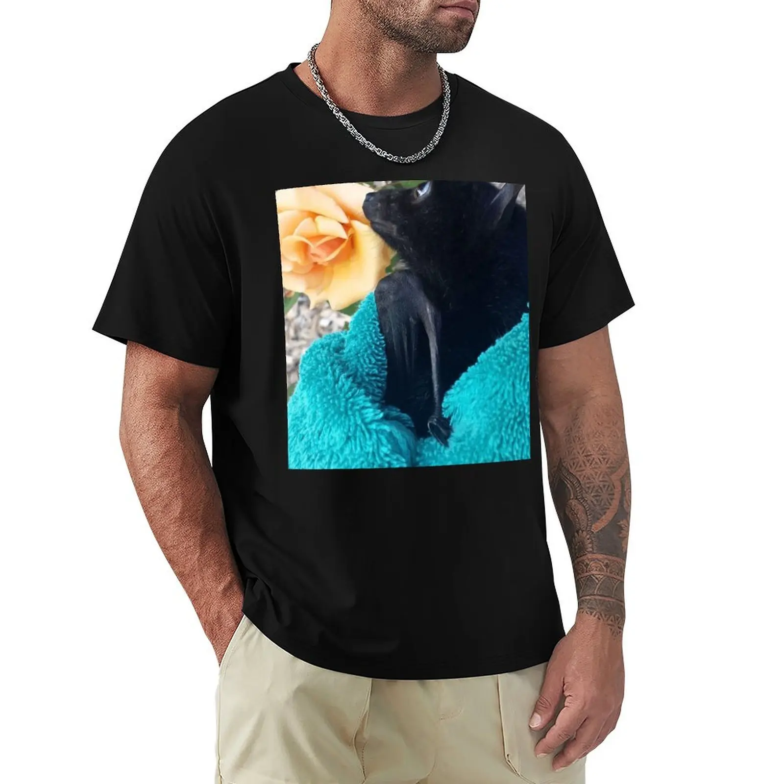 

Gorgeous Baby Bat Alegria Smelling A Rose. T-Shirt graphics sports fans cute tops oversized t shirt graphic t shirts men