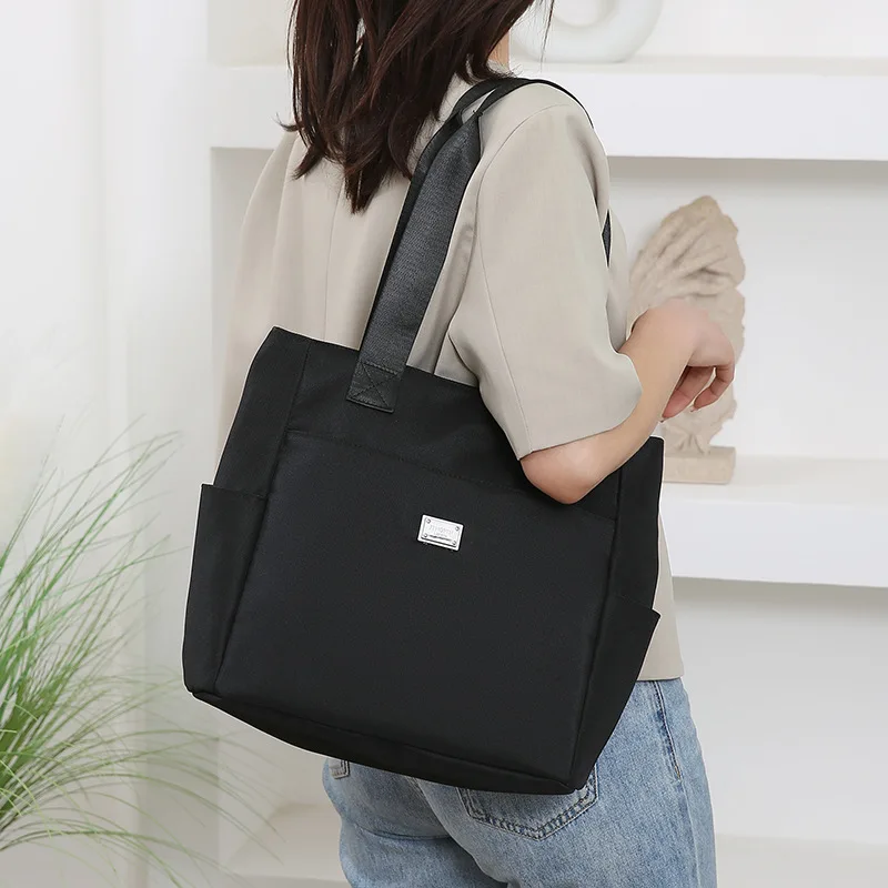 

Large capacity textured tote bag, hand-held sail cloth bag, fashionable and versatile commuting women's bag, shoulder bag