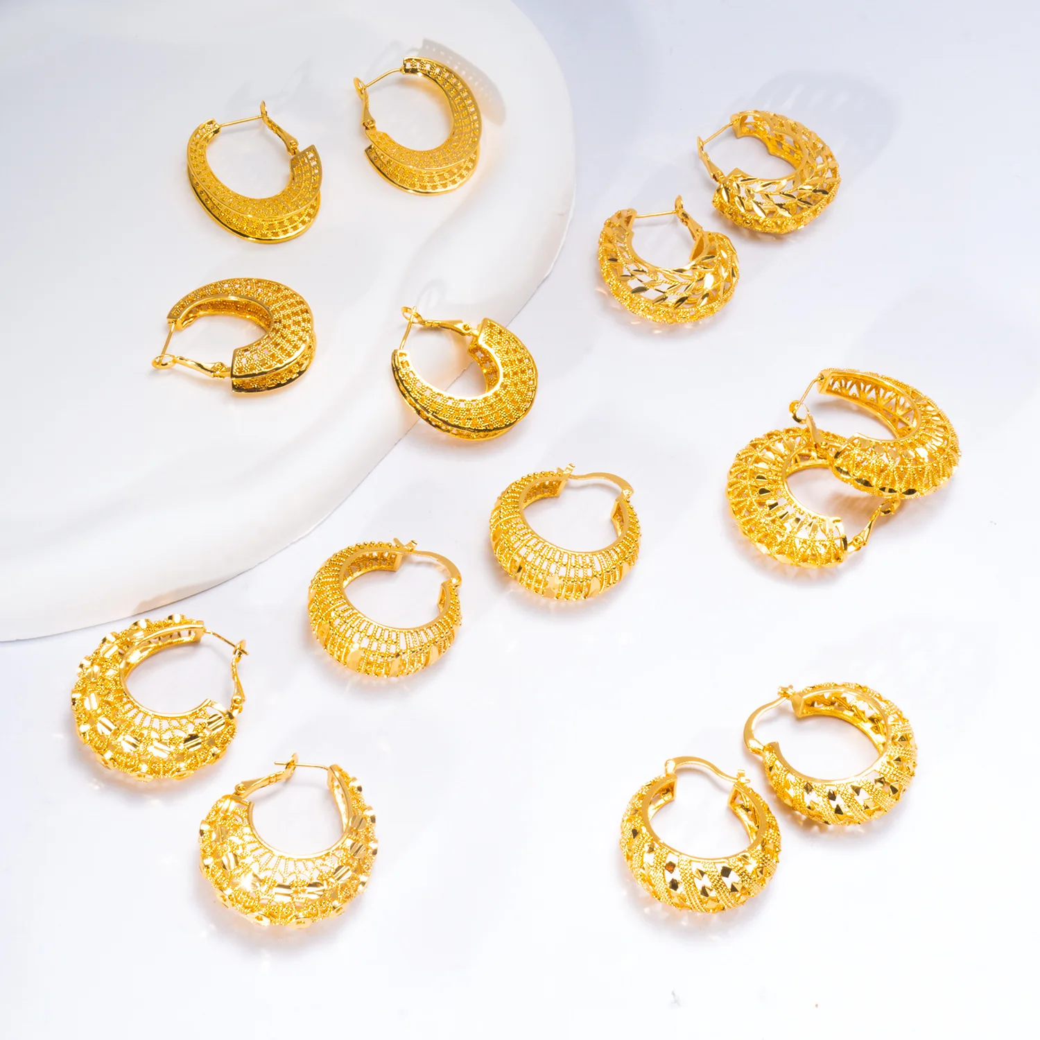 9999 gold high-end luxury niche earrings with heavy craftsmanship, featuring retro style and European design