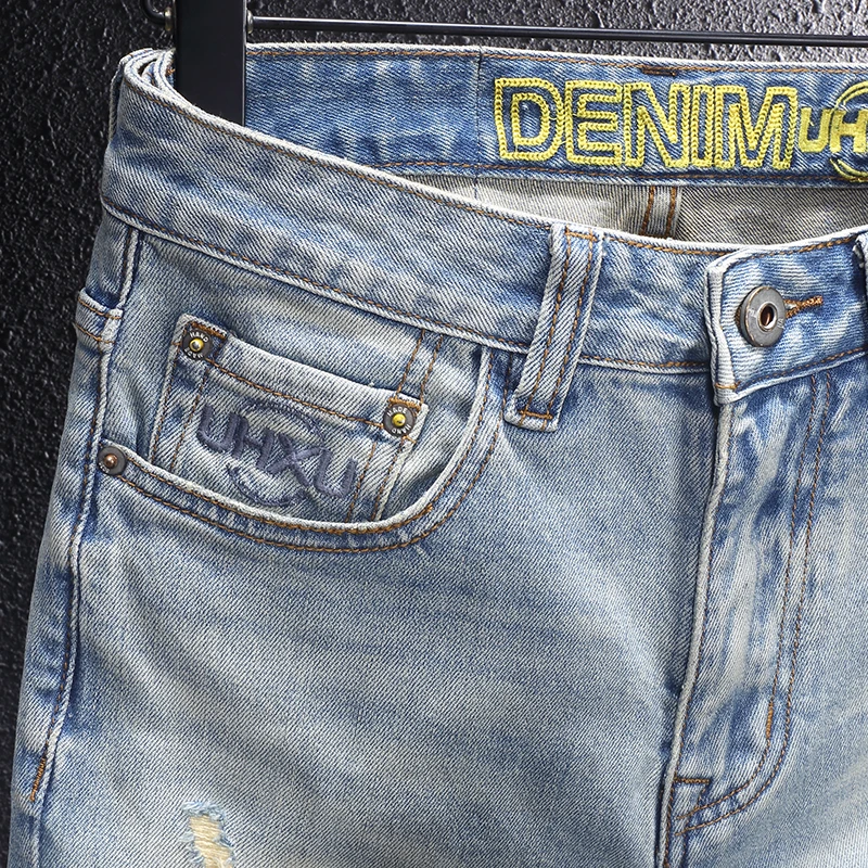Y2Knew denim jeans, washed with nostalgia, elastic, slim fit, pleated, painted light blue jeans, high street embroidere