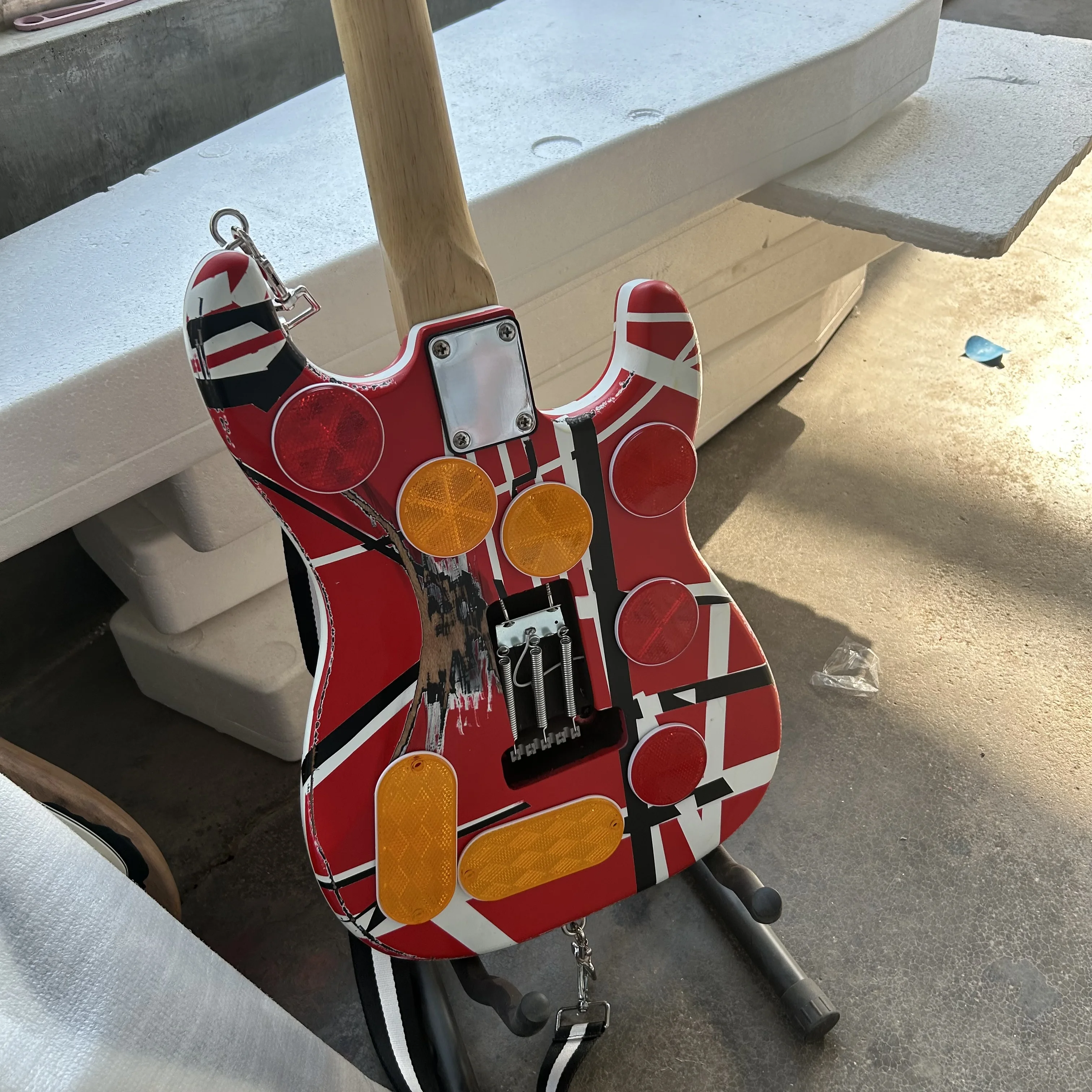 Left hand Edward Eddie Van Halen heavy cultural object red Franken electric guitar black and white stripes Freud rose Tremolo