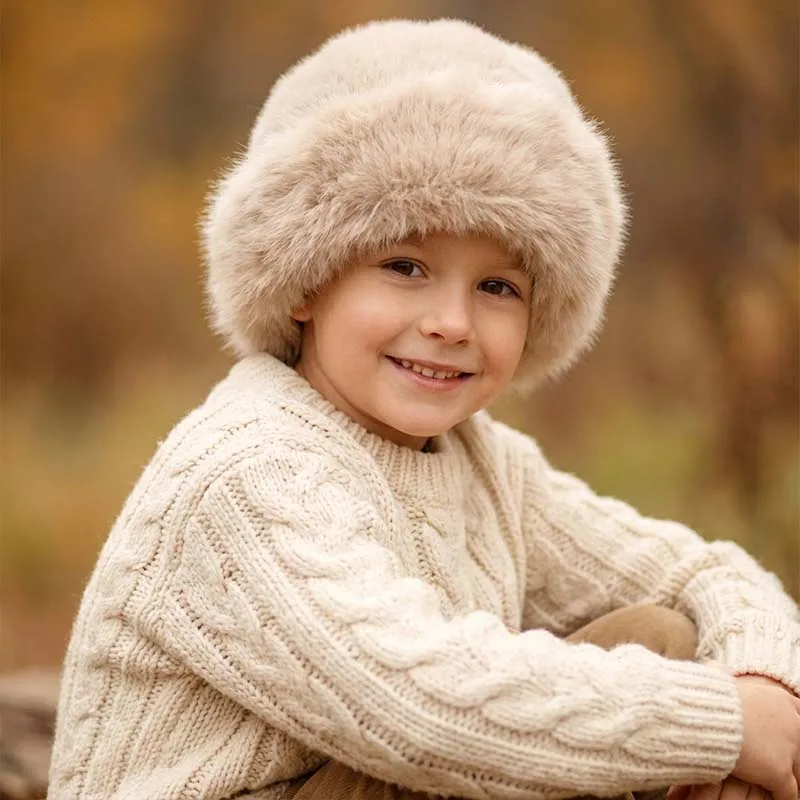 Gorro de invierno para niños de piel sintética estilo mongol, cálido, a prueba de viento, con orejeras de felpa, gorro suave y grueso para niños y niñas.