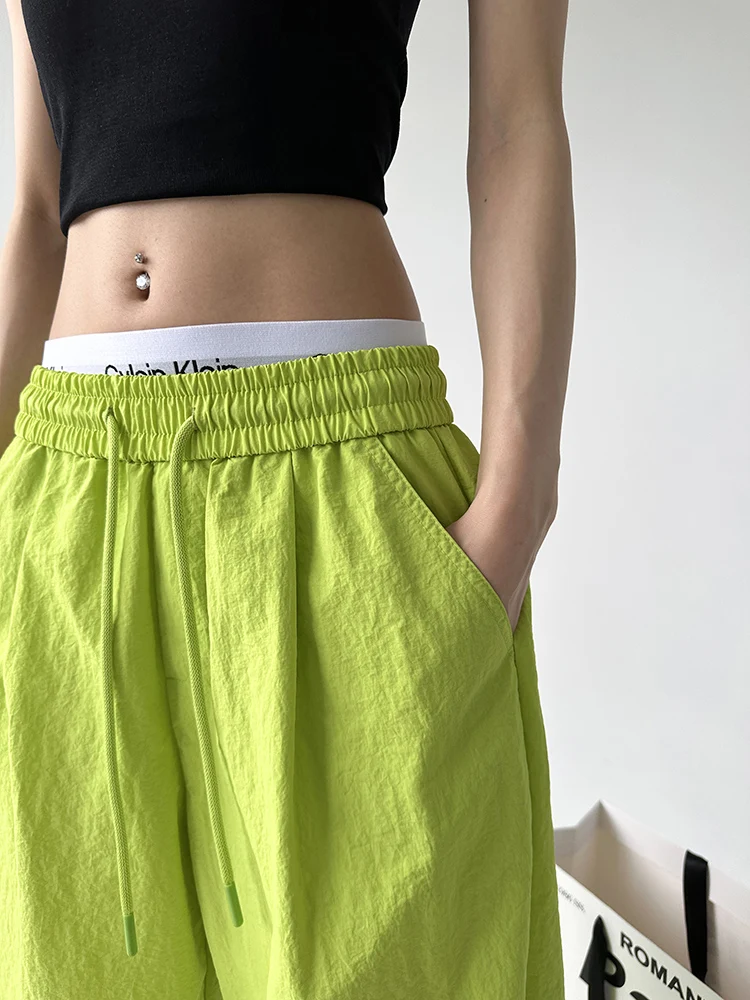 กางเกงกีฬาฟลูออเรสเซนต์สำหรับผู้หญิง ทรงลำลอง ขาตรง ช่วยให้ดูผอม สไตล์สตรีท สวมใส่สบาย เอวสูง กางเกงขายาว