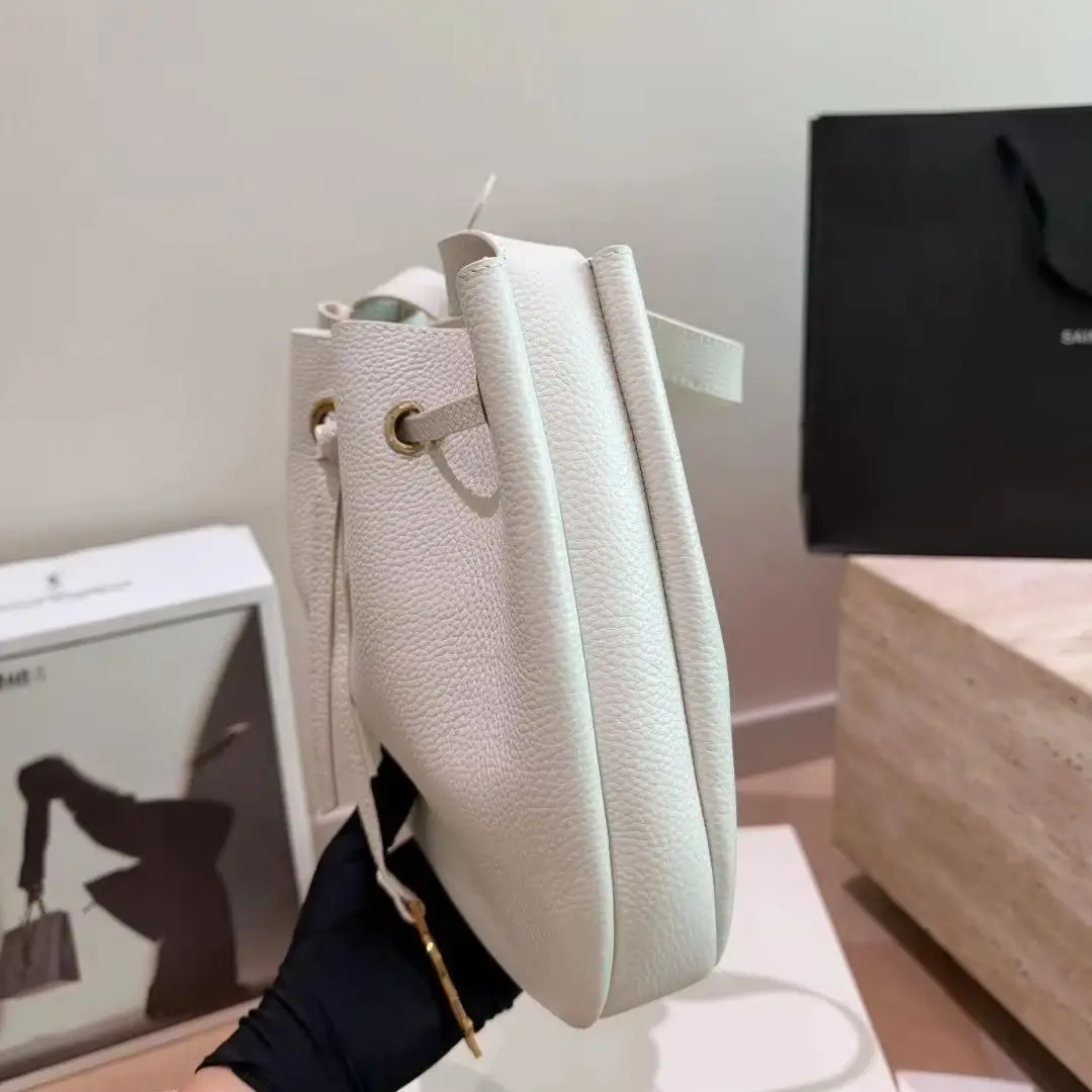 Off White Caviar Leather Drawstring Bucket Hobo Bag, Adjustable Wide Leather Shoulder Strap Bag with Gold Logo Charm, Luxury Designer Inspired Spring Daily Handbag