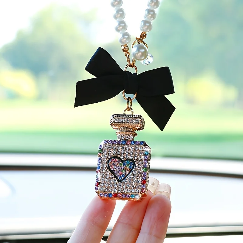 Fashionable bow knot diamond inlaid perfume bottle car interior pendant exquisite with drill car rearview mirror car accessories