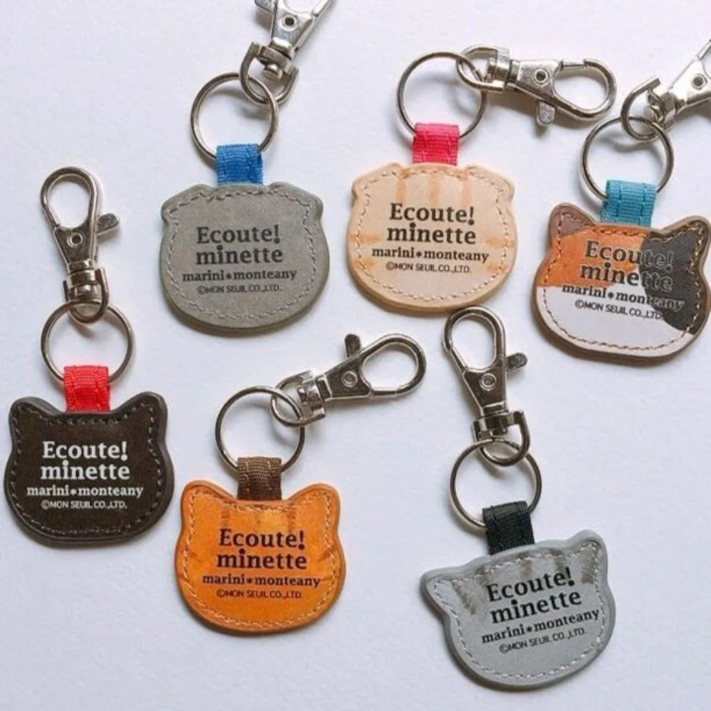 かわいい革の猫のキーホルダー、漫画の革のキーホルダー、クリエイティブなバッグペンダント、ファッション