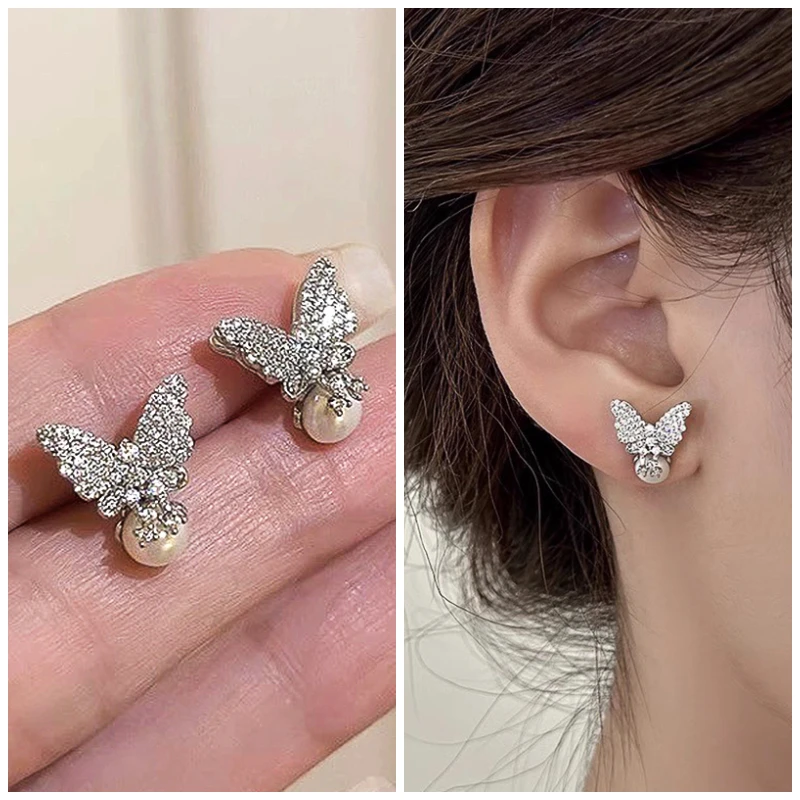 Huitan Neue silberfarbene Schmetterlings-Ohrstecker mit künstlicher Perle für Frauen, eingelegter, schillernder Zirkonia, exquisiter Schmuck