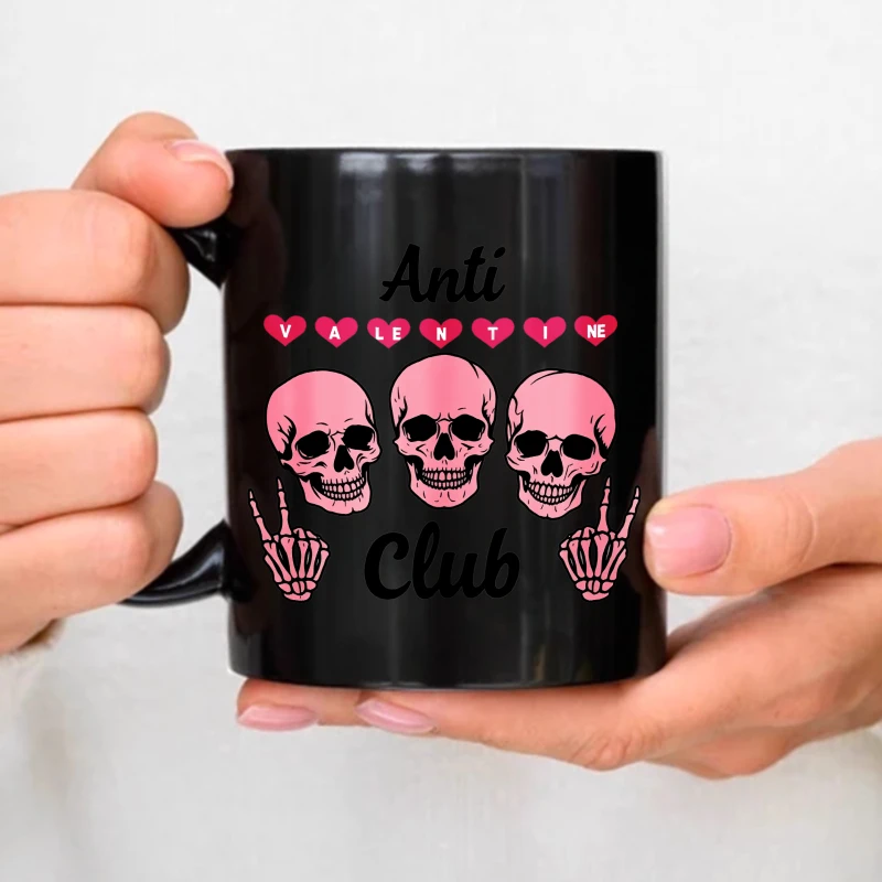 Anti-Valentine's Club black mug with pink skull and heart design, suitable as an anti-Valentine's Day gift