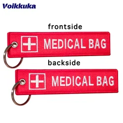 Llavero con logotipo cruzado para motocicleta, bolsa médica con etiqueta roja bordada en ambos lados, accesorios para llaves, 2 piezas 3 piezas, 1 unidad