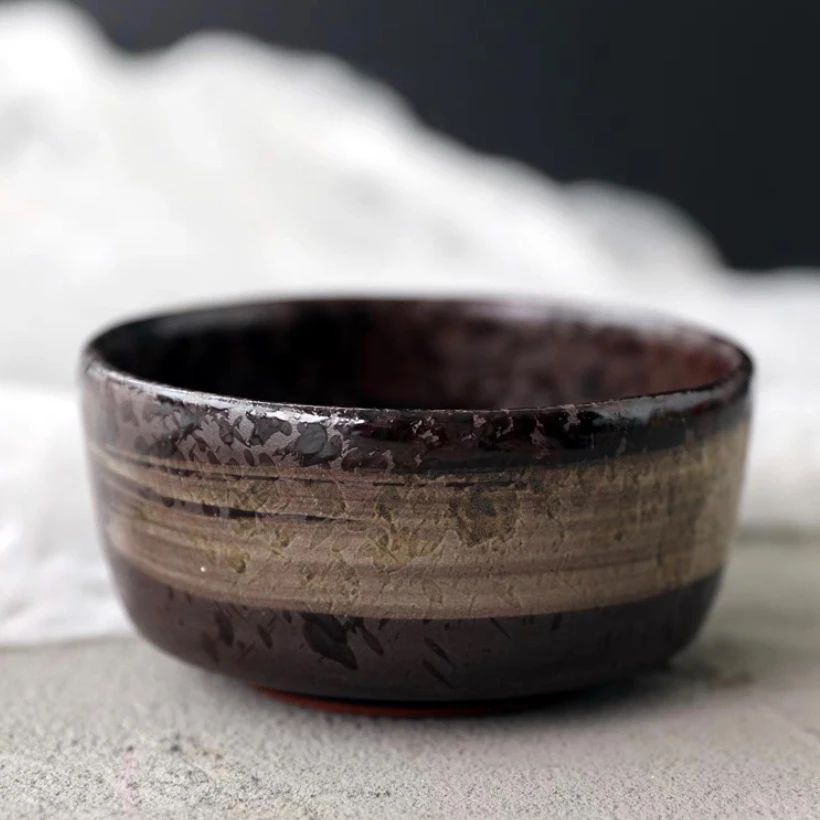 

Creative Japanese style and wind black ink-jet ceramic small bowl retro coarse pottery dessert bowl home soup bowl rice bowl.