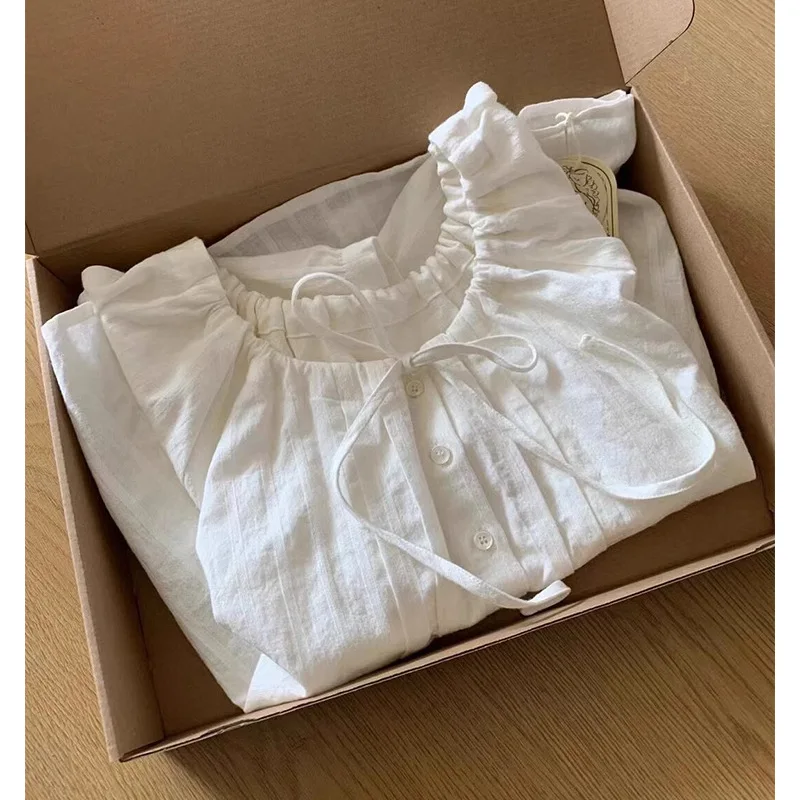 

Korean white cotton and linen doll shirt women's crew neck drawstring pleated lace-up short-sleeved top