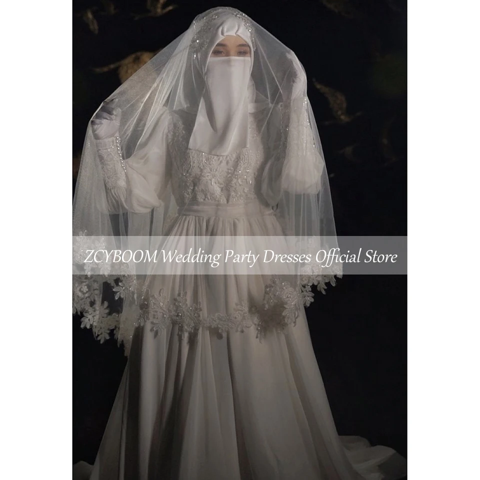 Suknia ślubna muzułmańska z wysokim dekoltem, cekinowymi aplikacjami, koralikami, długimi rękawami, kokardą, długością do podłogi i trenem zamiatającym, model 2025, szyta na miarę.