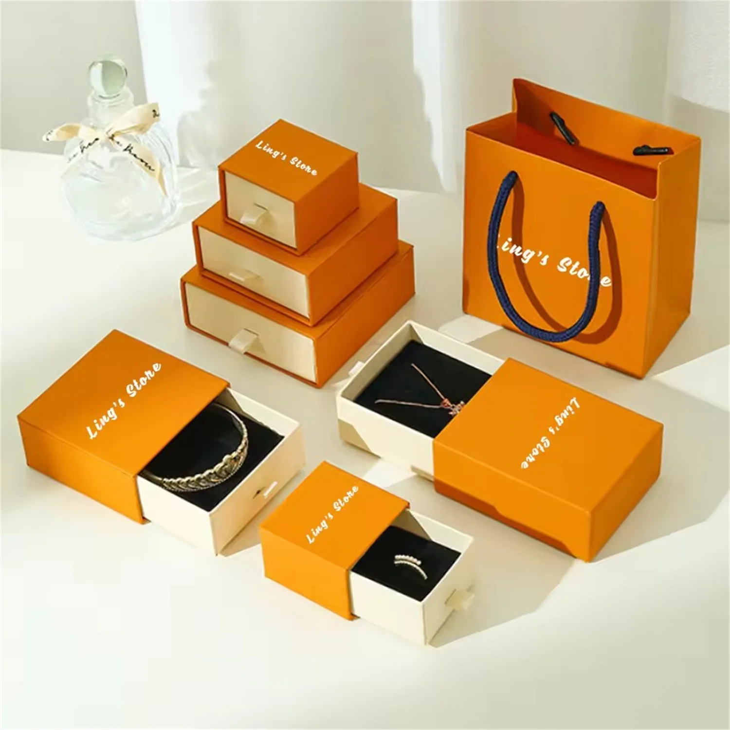 

50Pcs Luxury Personalized Orange Beige Jewelry Drawer Gift Box Rings Earrings Bracelet Pendant Necklace Paper Handle Storage Bag