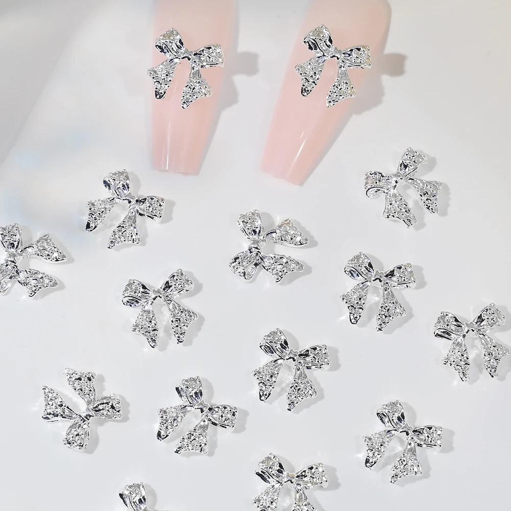 50 pezzi in lega di metallo bowknot gioielli per nail art oro argento papillon ciondoli per unghie super flash farfalla forniture per unghie accessori fai da te *