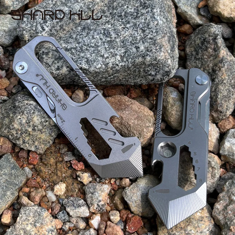 Portable titanium alloy outdoor survival keychain with built in small knife and bottle opener hanging clip for EDCCamping enthus