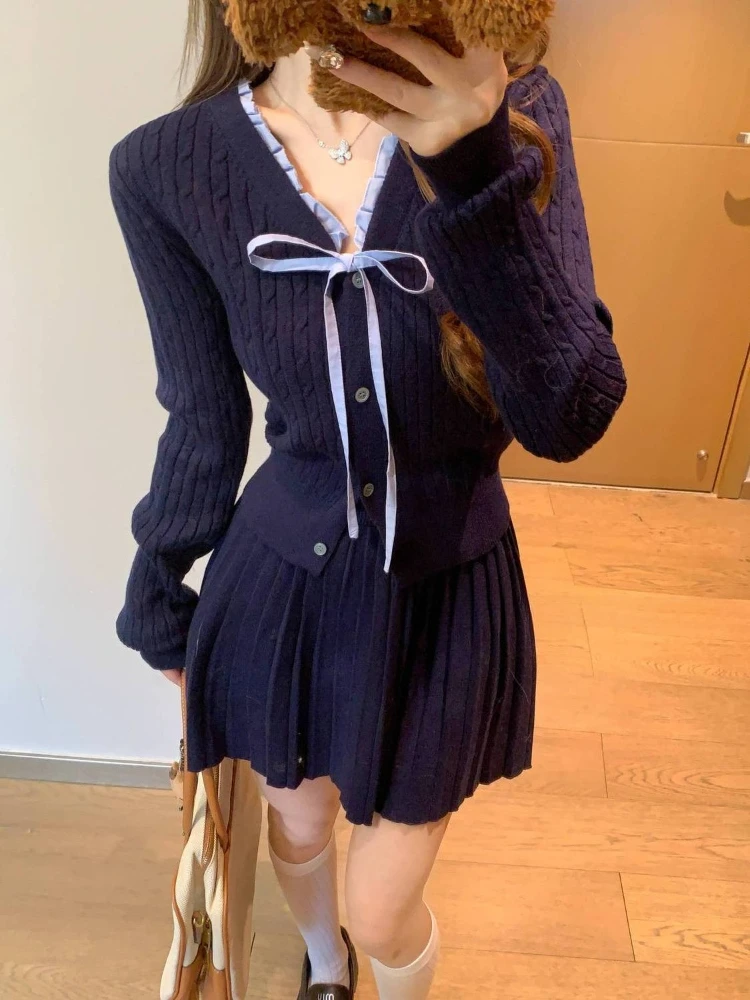 Spring and Autumn new Korean version bow lace-up single breasted V-neck knitted cardigan+pleated short skirt two-piece set