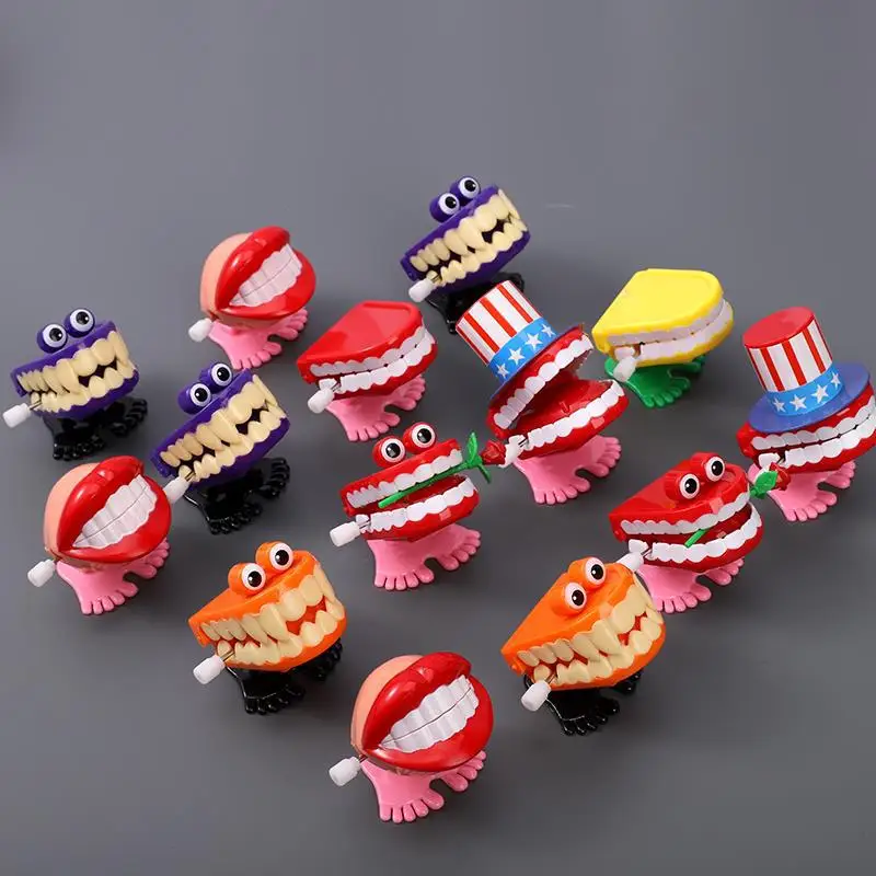 

1PC Funny Clockwork Toy Upper Chain Jumping Tooth Toy Children Jump Teeth Running Clockwork Spring Wind Up Toy