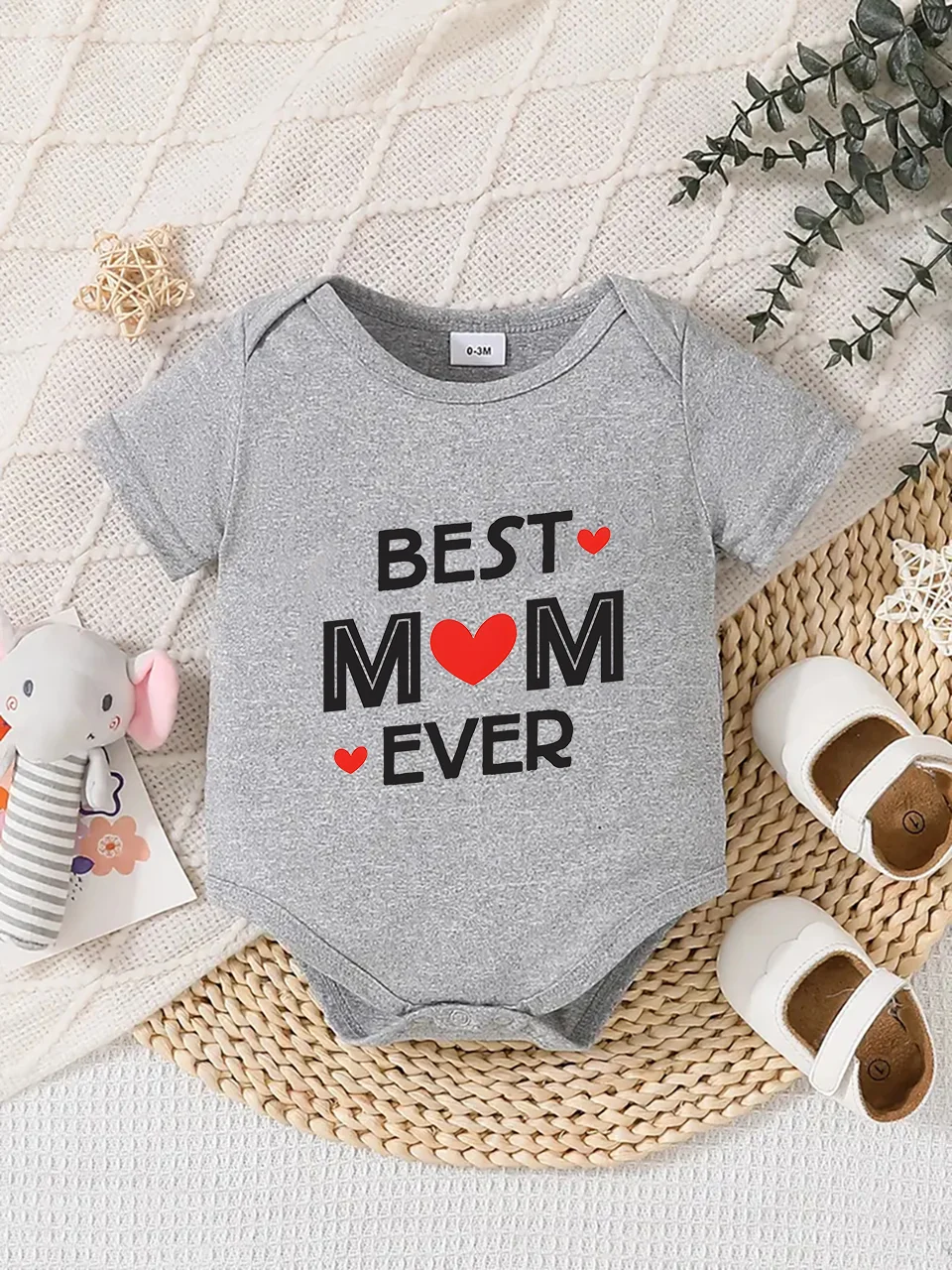 Playful letter-printed baby short-sleeve triangle bodysuit. Button closure for easy dressing, machine washable