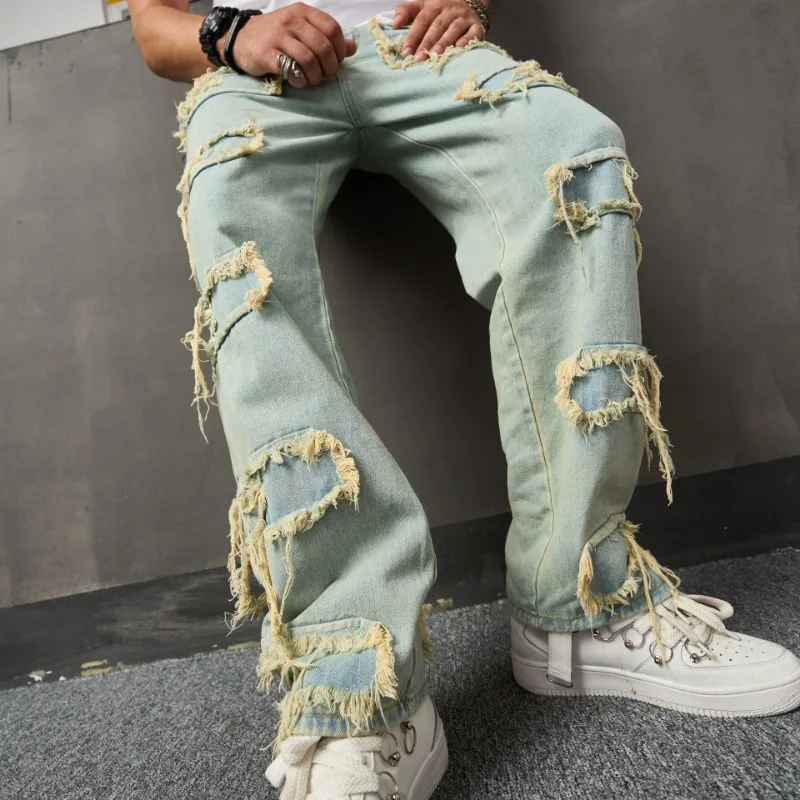 Nuovi pantaloni da uomo casual a gamba larga alla moda con barba sciolta in denim bionico con toppa in tessuto cucito strappato