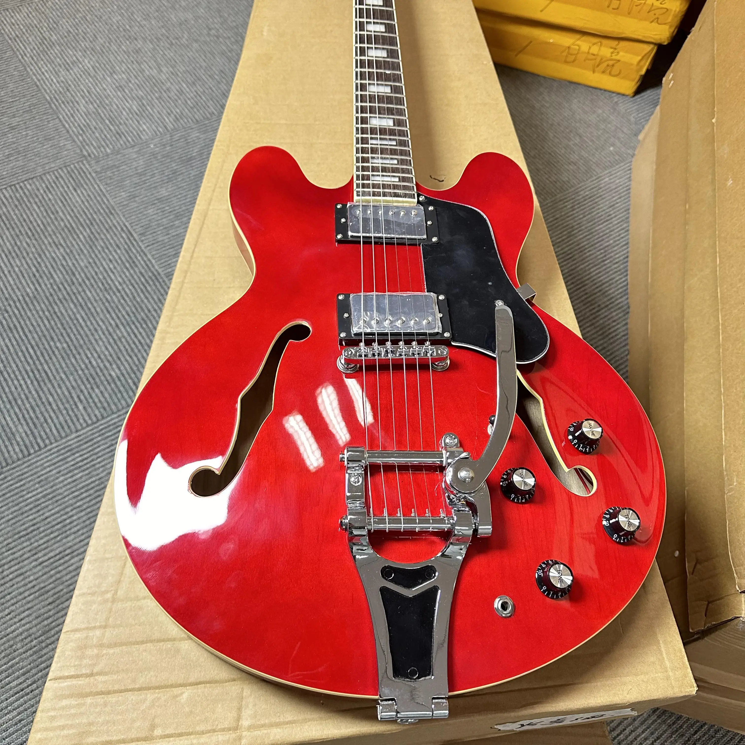 

Custom half hollow electric guitar with red body and silver accessories, equipped with a rocker, of high quality, free shipping.
