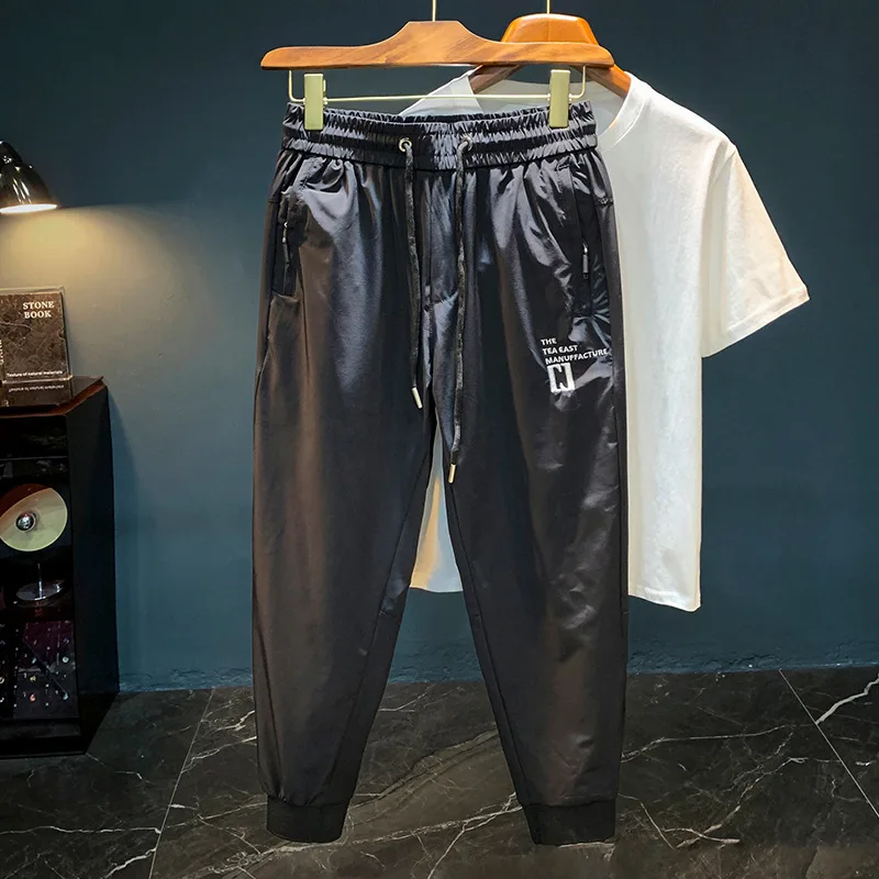 Ultra thin ice silk quick drying casual pants for men in the summer of 2025, new leg binding elastic waistband sports pants
