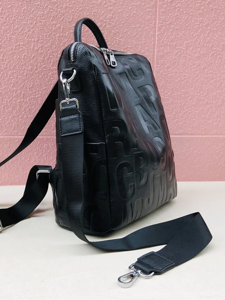 Mochila informal de piel de vaca auténtica para mujer, bolso de viaje de estilo coreano con letras negras, Bolsa Escolar para adolescentes