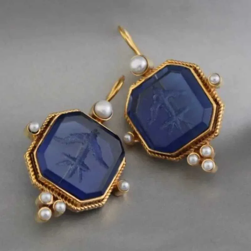

Gorgeous Inlaid with Blue Stones Imitation Pearl Earrings Gold Color Metal Carving Flower Dangle Earrings for Women Jewelry
