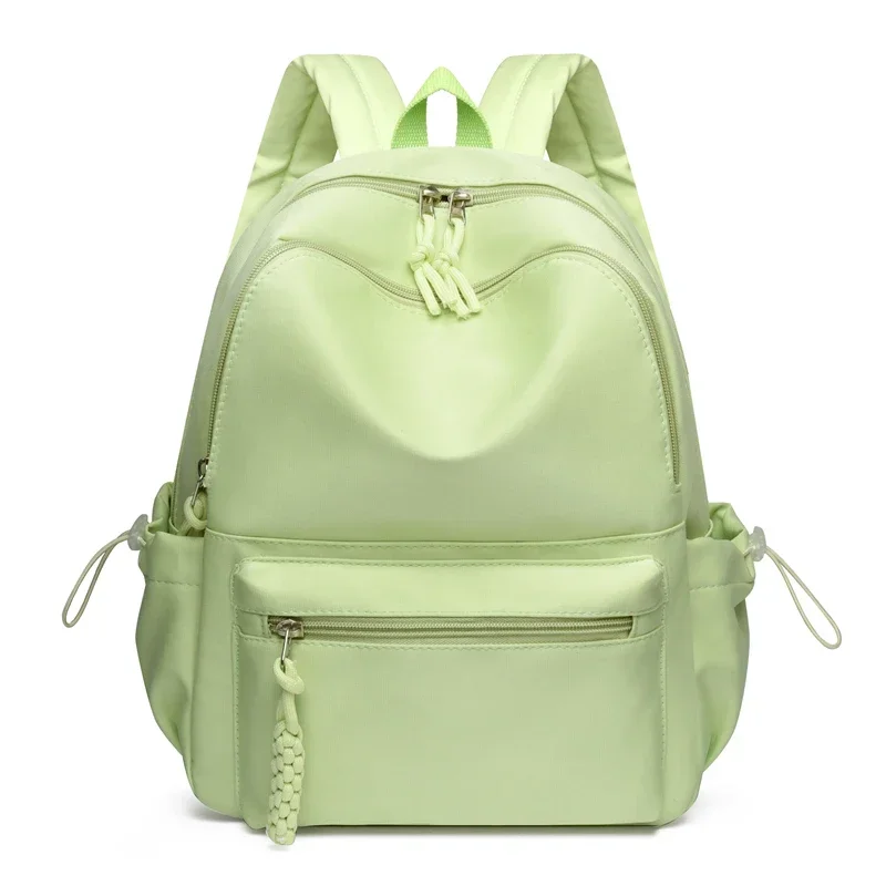 Mochila de Color sólido para mujer, superventas, cremallera de nailon, nuevo bolso de viaje con hilo de coser, mochila escolar juvenil de alta calidad 2024