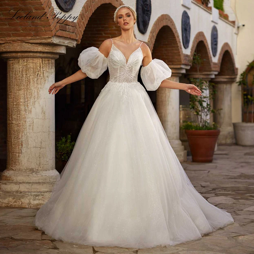 

Lceland Poppy Customized A Line V Neck Tulle Wedding Dresses Sleeveless Floor Length Beaded Bridal Gowns with Puff Sleeves