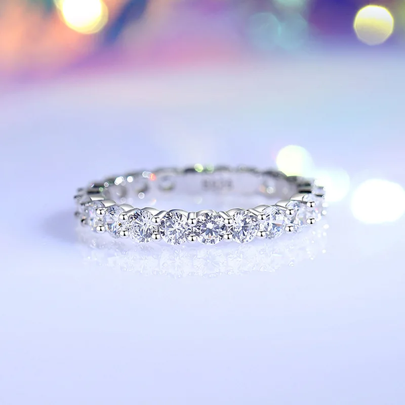 S925 silver ring for women featuring lab-grown moissanite stones set in geometric band—elliptical and circular motifs, minimalis