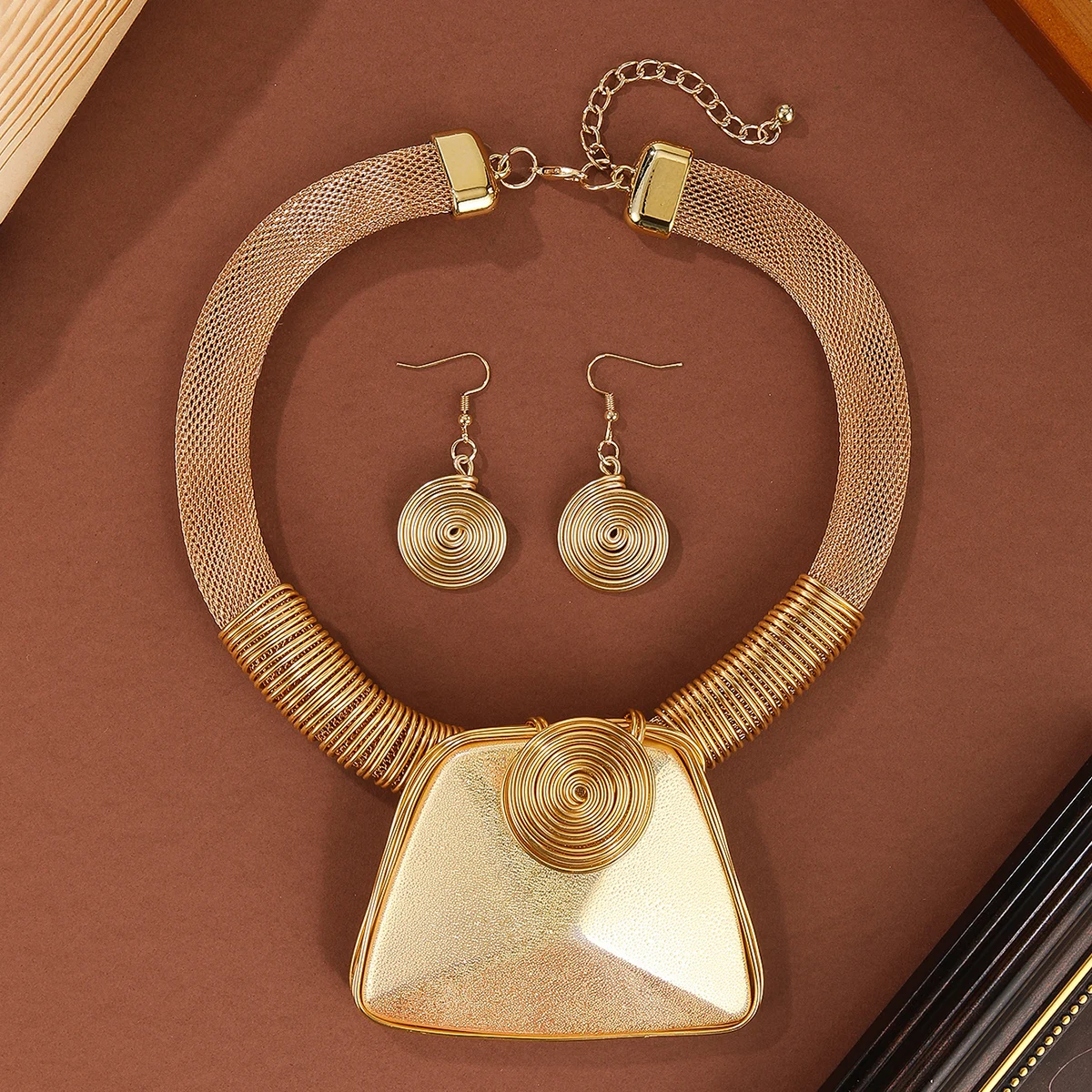 

A set of golden exaggerated resin pendant necklace and earrings, aluminum wire woven acrylic large gemstone jewelry