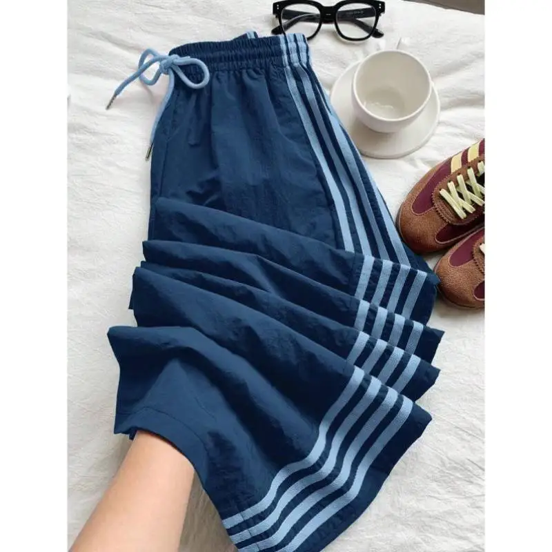 

Свободные брюки с эластичной резинкой на талии и полосками по бокам, повседневные трансграничные брюки P83789, мужские девятисекционные брюки в стиле ретро Ciwalk