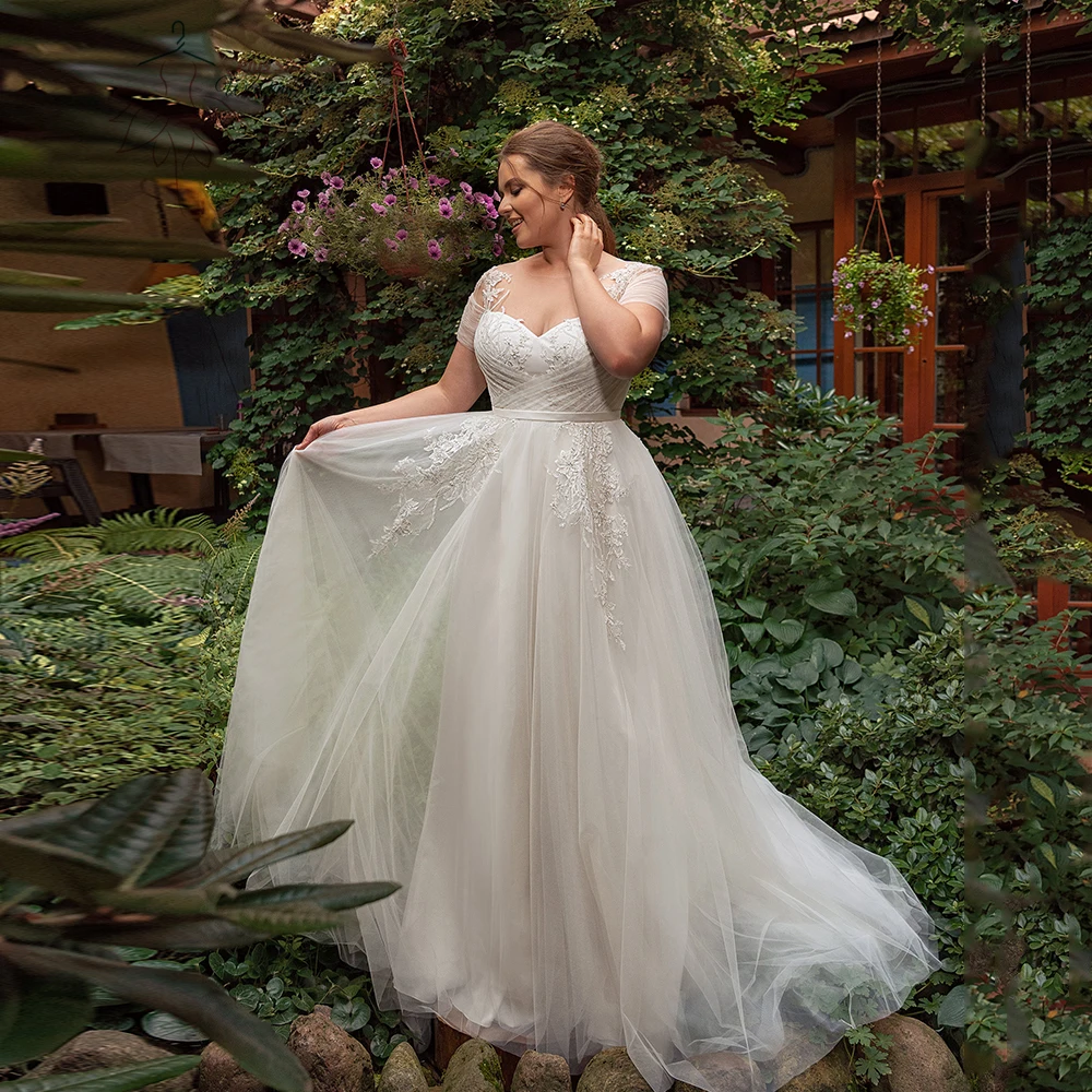 فساتين زفاف أنيقة من التل مقاس كبير رقبة جوهرة وأكمام قصيرة فساتين العروس مزينة بقطار سويب على شكل حرف a فيستدوس دي نوفيا