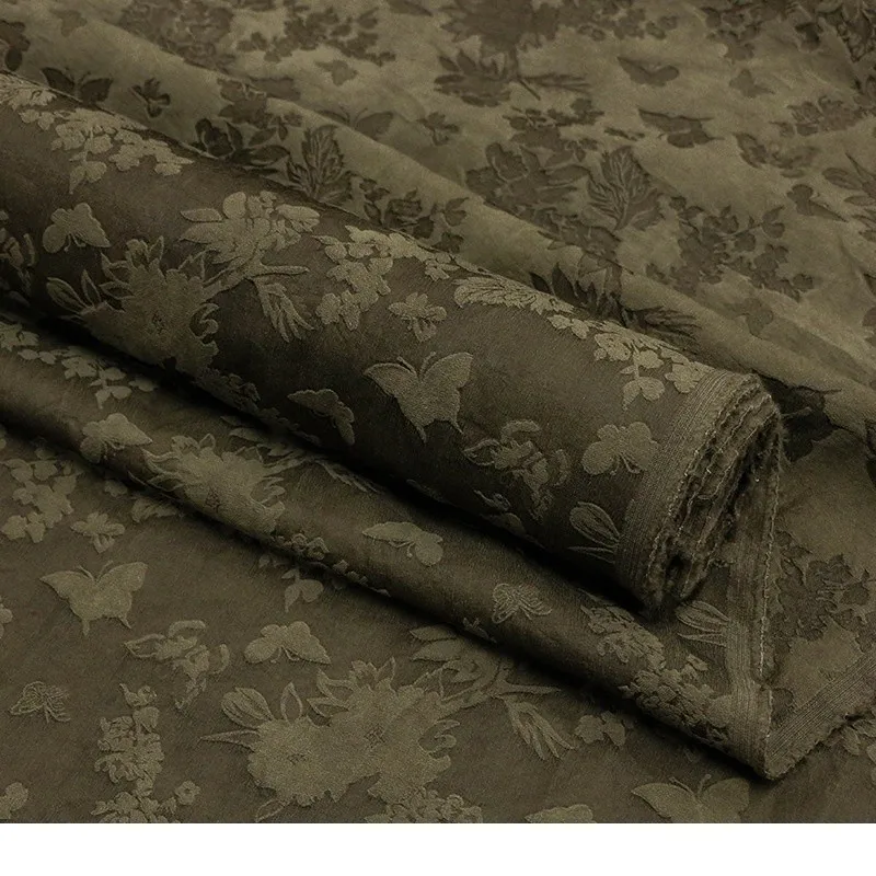 Plant mud-dyed heavy-weight silk and wool jacquard fabric is made into designer by traditional dyeing methods