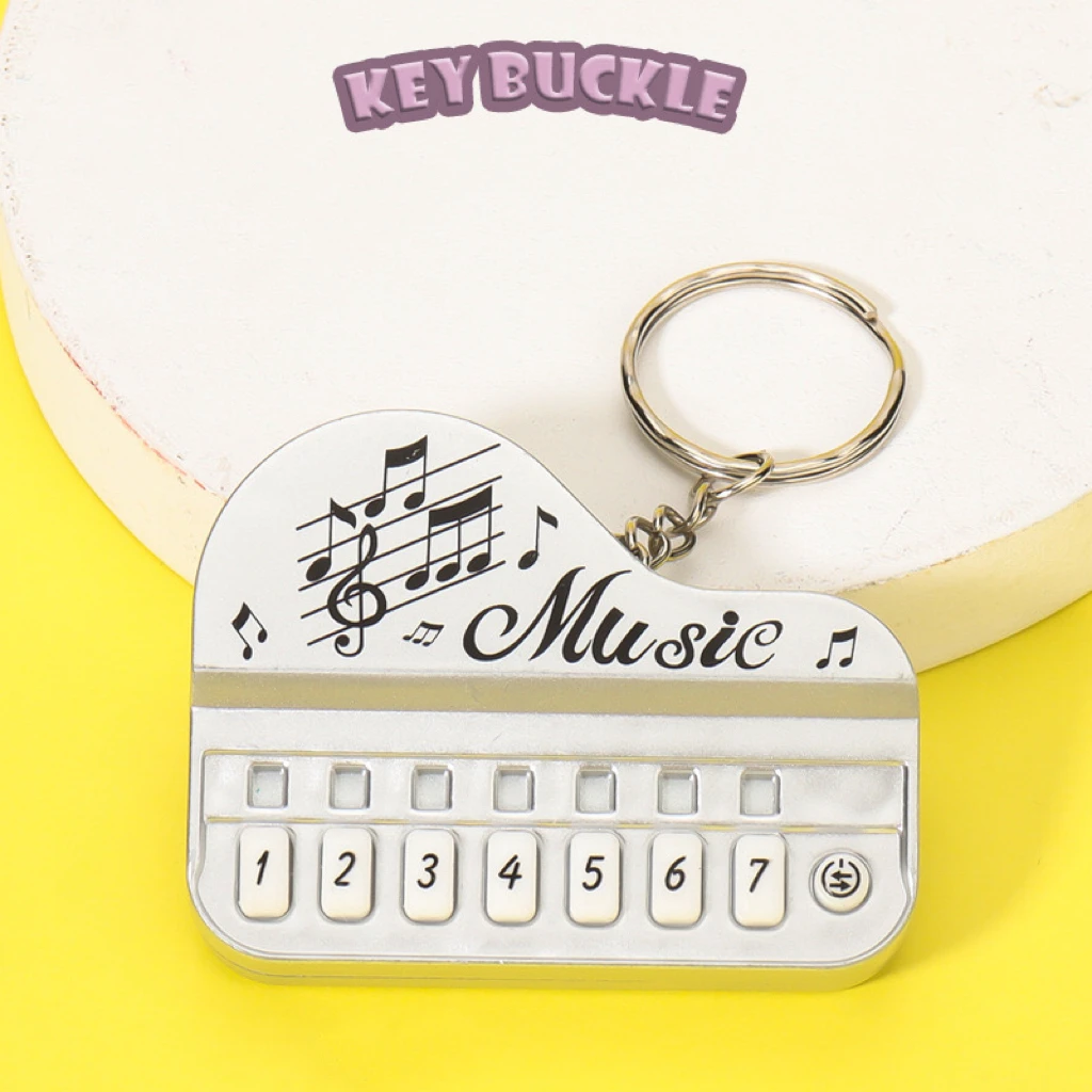 1Pc Mini Luminous Electronic Piano Keychain Portable Handheld Small Electric Musical Instrument Pendant Creative Cute Music Toy view 4
