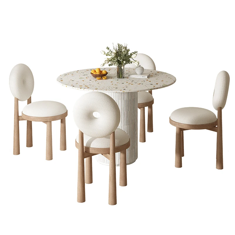 The combination of dining table and chair on the rock plate is a modern, advanced sense of round table for household use.