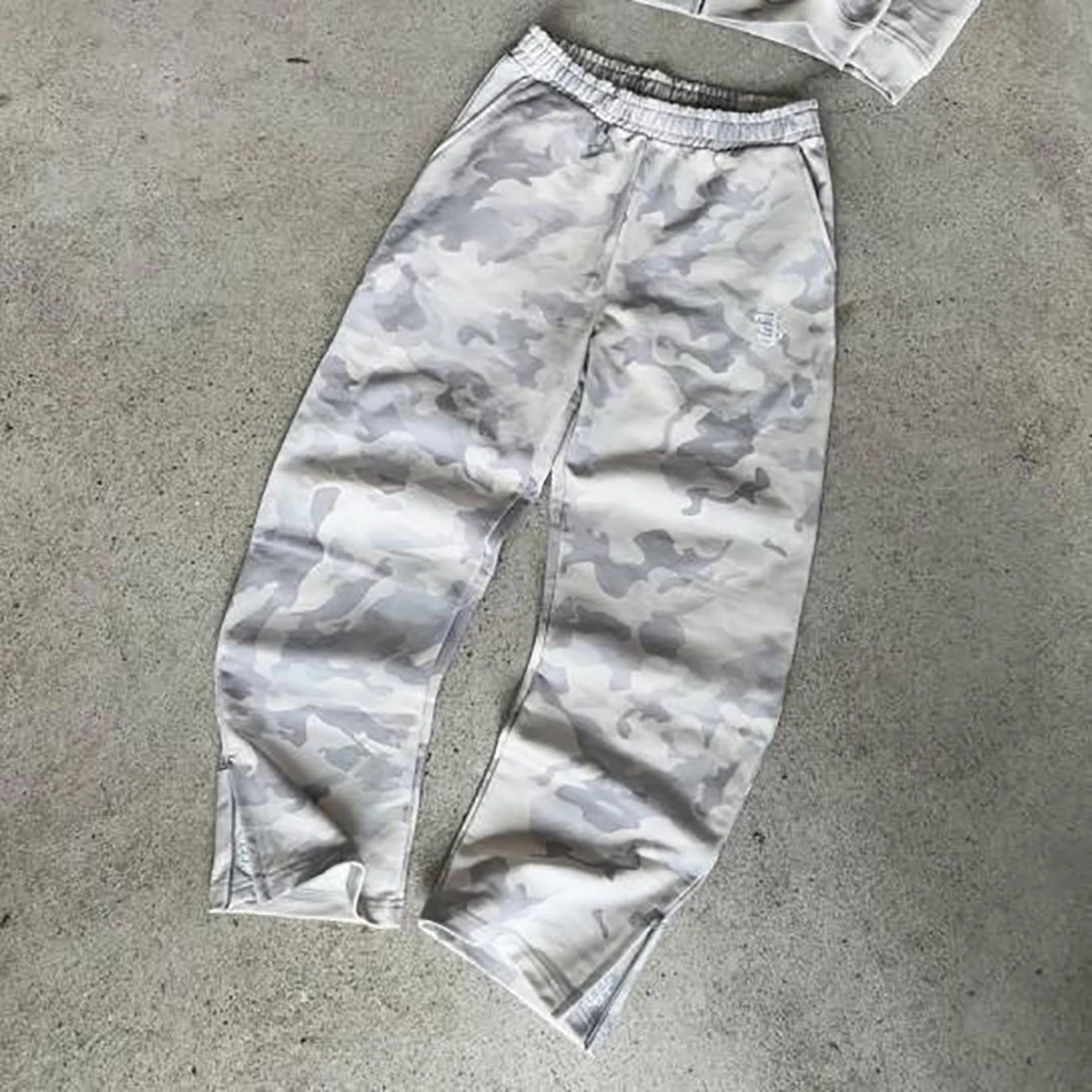 2025 hombres y mujeres high street hip-hop rap street Nueva cuerda elástica cremallera sudadera pantalones color sólido pantalones casuales