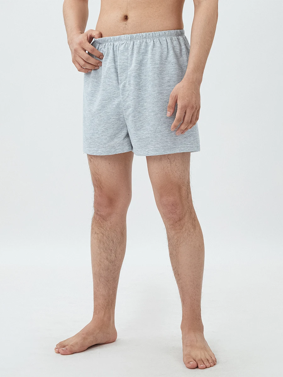 Short de salon pour femmes et hommes, couleur unie, fente latérale, confortable, taille élastique, short de sommeil, pantalon carillon