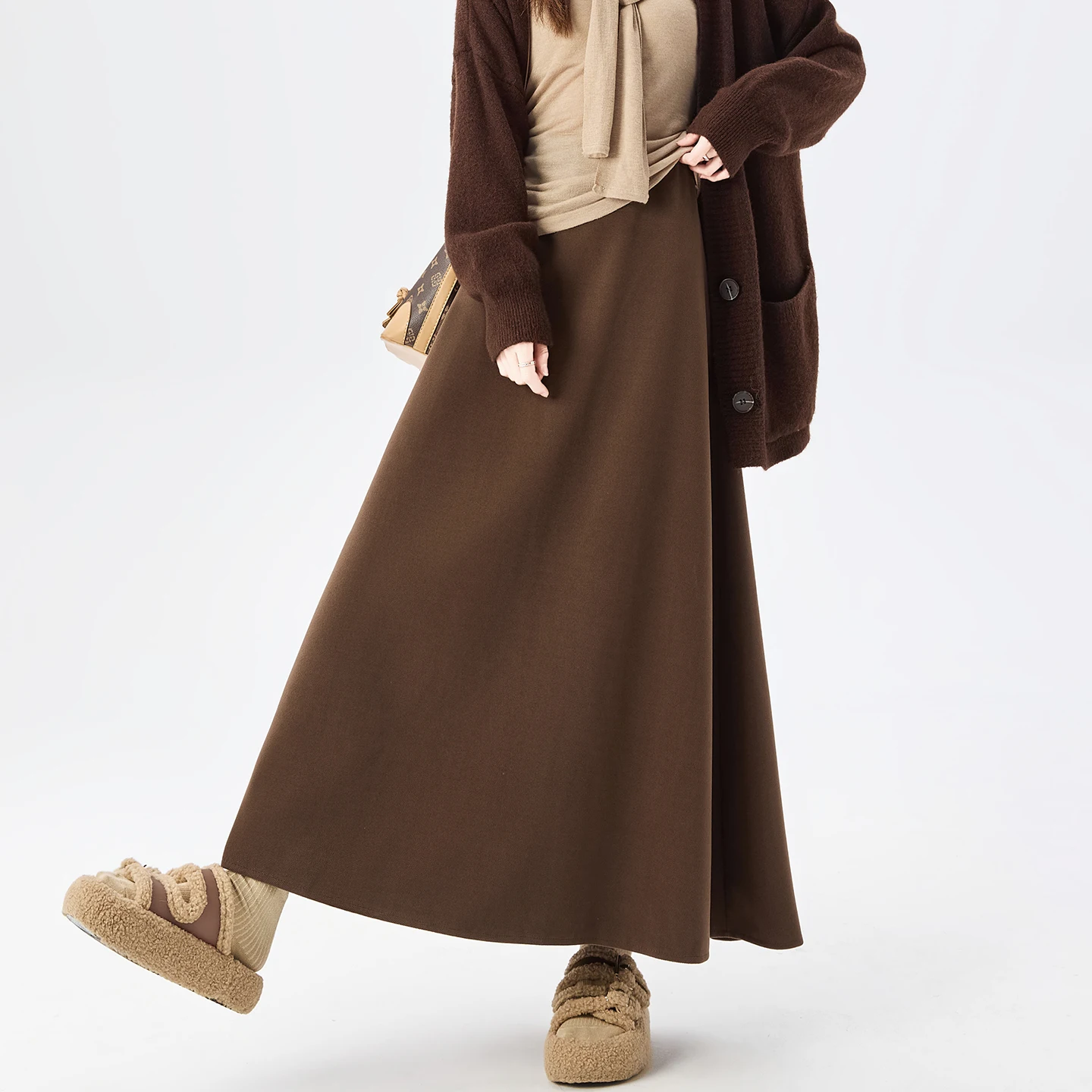 กระโปรงขนสัตว์คุณภาพสูงสำหรับผู้หญิง ฤดูใบไม้ร่วง ฤดูหนาว ดีไซน์หรูหรา ทรงเอ หนา สีดำ กระโปรงผู้หญิง เอวยางยืด ทรงตรง แฟลดาส 2025