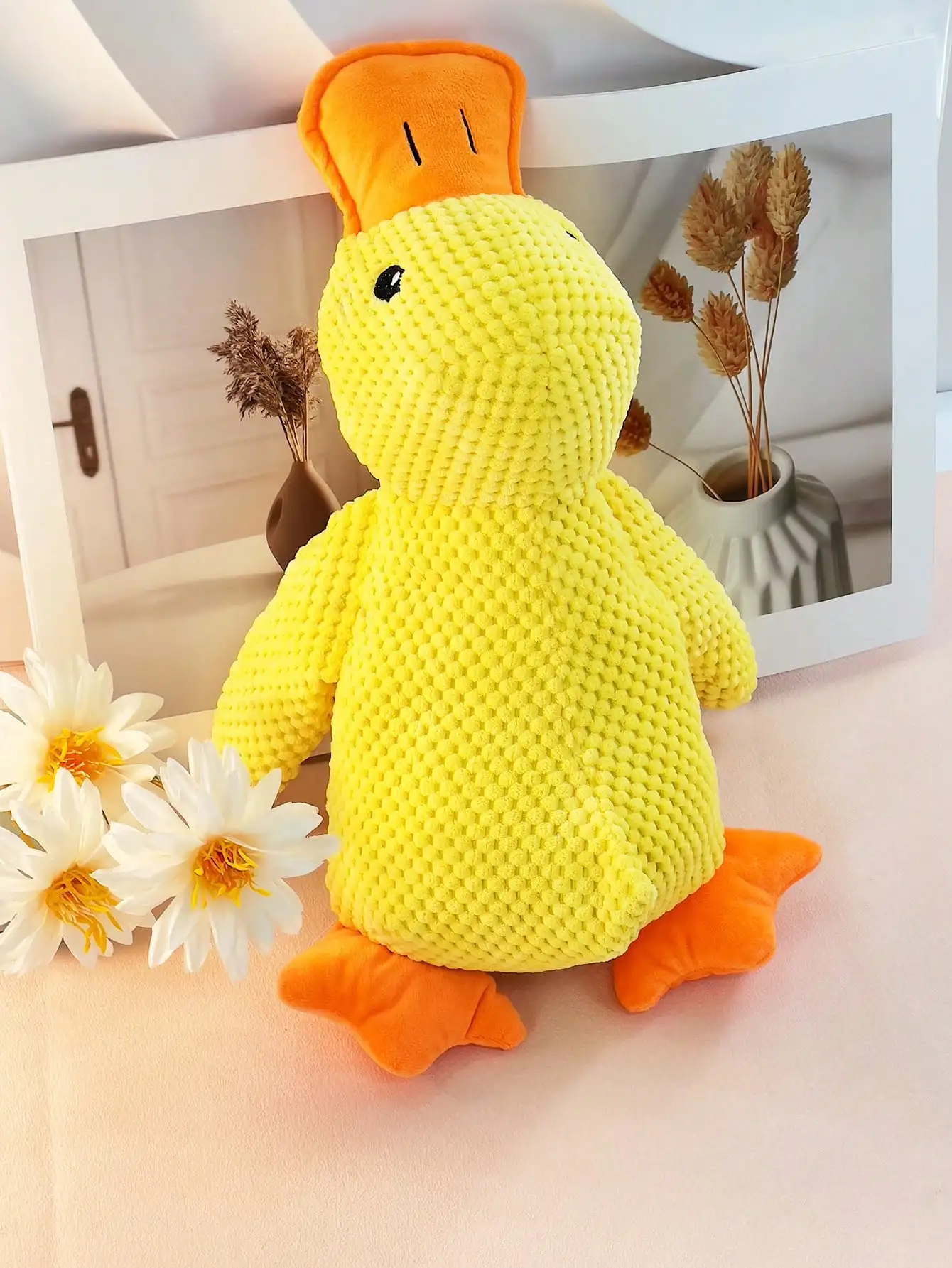 large, yellow, large duck pet stuffed toy that squashes and plays with the dog can be used as a pillow for pets only