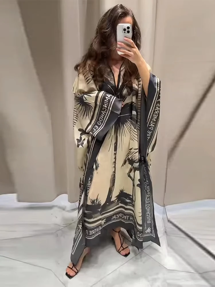 ヴィンテージプリントの流れるようなボヘミアンマキシドレス。 休日、フェスティバル、休暇に最適な女性用のリラックスしたVネック長袖ドレス。