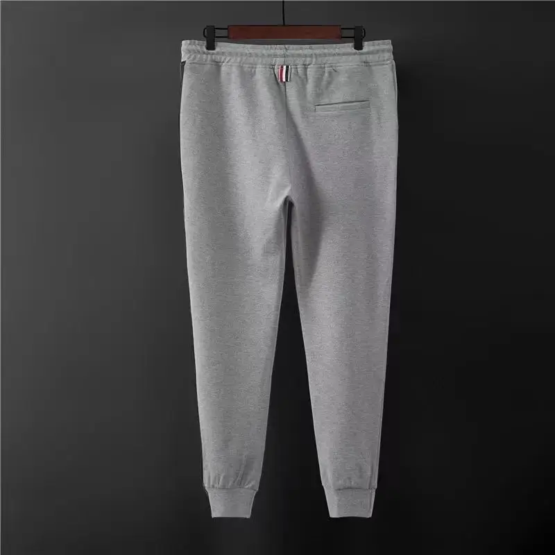 Calça de moletom clássica de tecido lateral para homens, calças esportivas casuais, calças compridas amarradas com pernas, calças cortadas da moda, outono, 2024