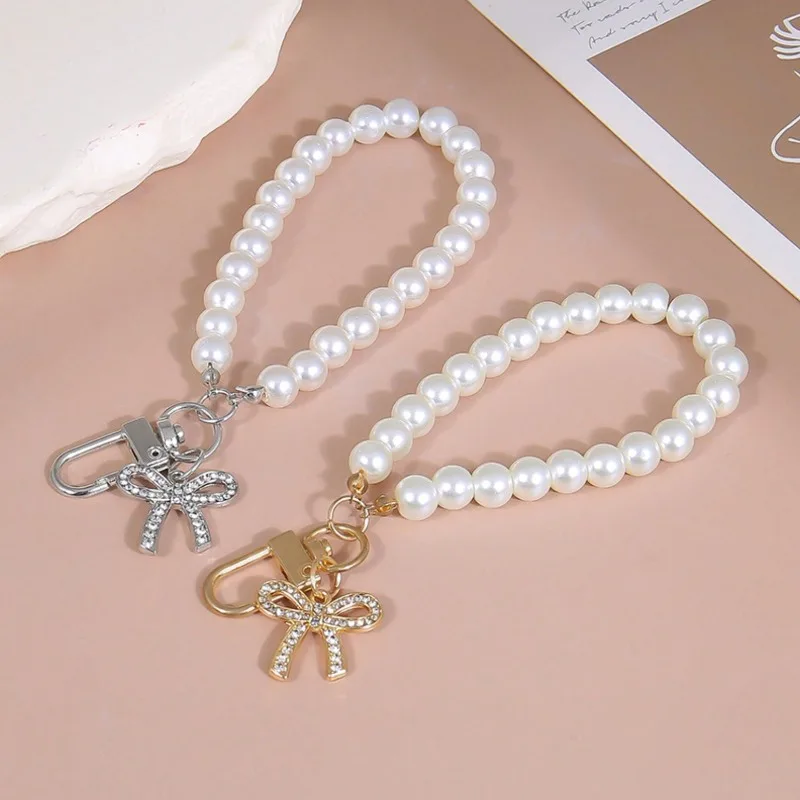 

New - Style Phone Case Ornament Bow Diamond - Inlaid Hanging Chain Glass Faux Pearl Handheld Bead Chain Short Strap Bag Pendant