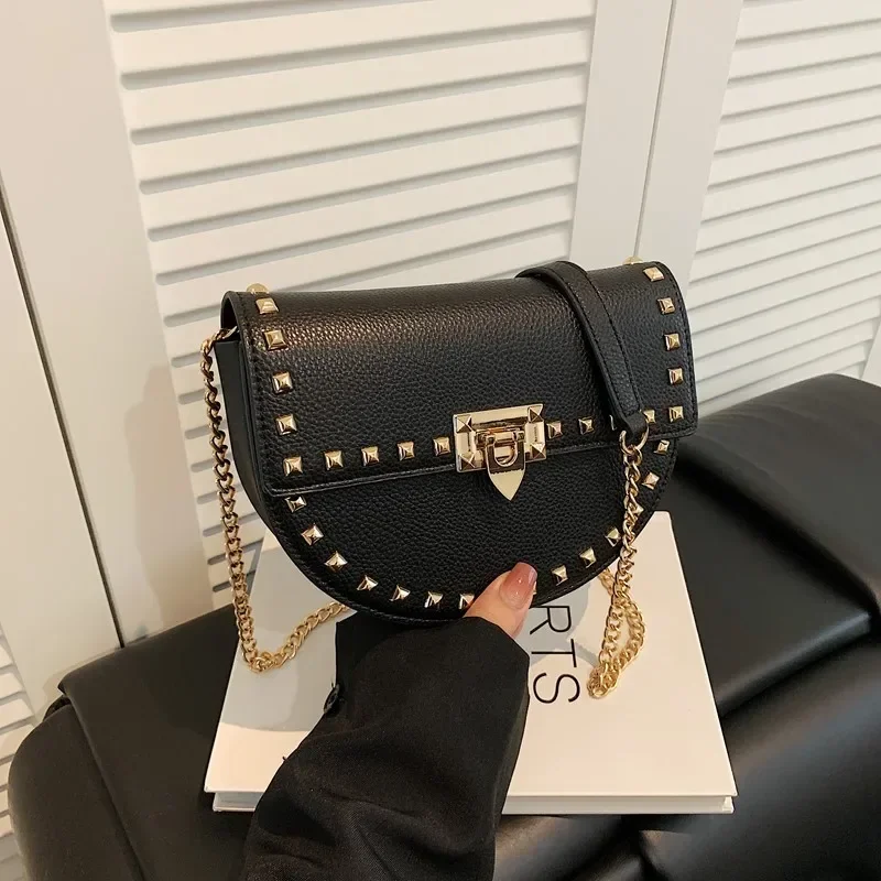 

2025 Rivet Solid Color Saddle Bag — Versatile Shoulder/Messenger, Lock Chain Strap for Travel & Daily