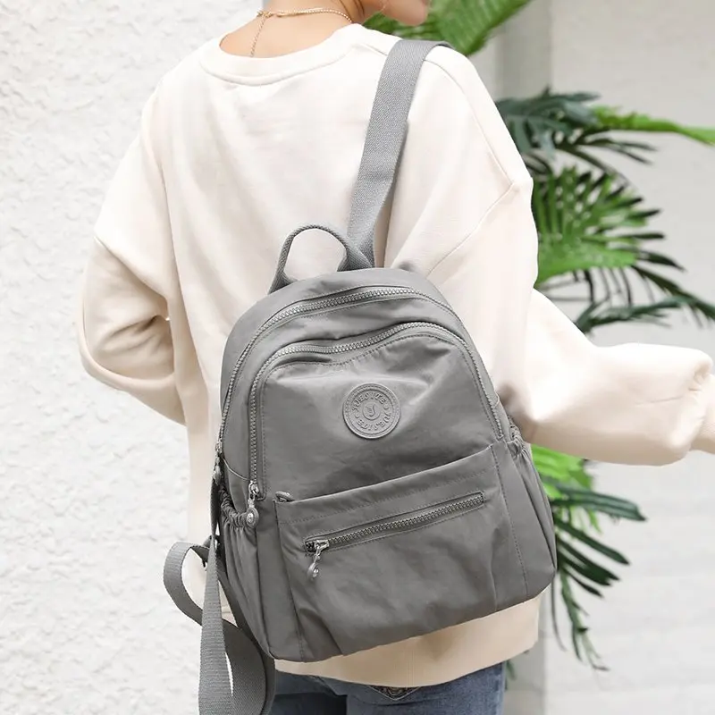 Mochila de gran capacidad para mujer, bolso de viaje ligero y sencillo que combina con todo, bolso escolar de nailon Oxford